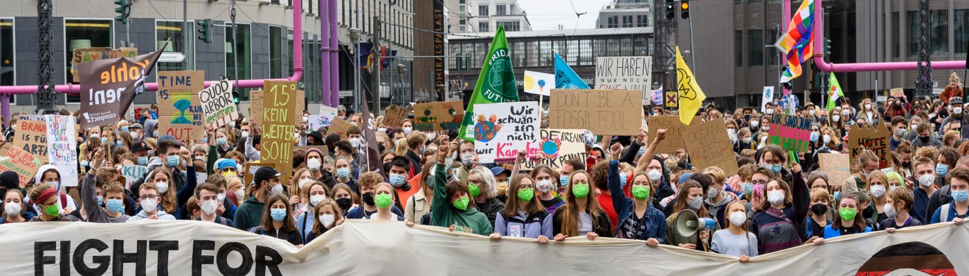 Street Protest with climate justice banner at the front